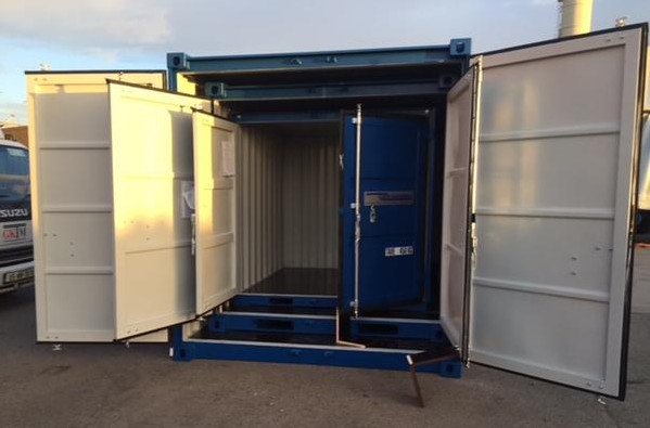 Blue and white container with double doors open at both ends